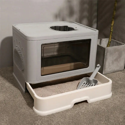 Foldable enclosed cat litter box with top entry, scoop holder, and modern design
