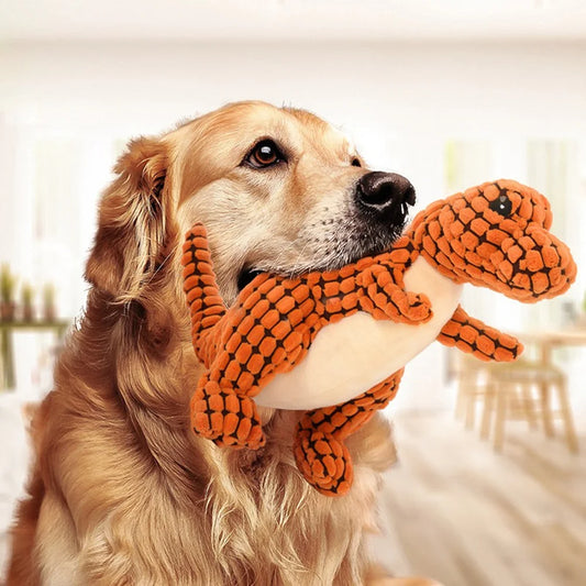 Brown plush dinosaur dog chew toy with squeaker for interactive play
